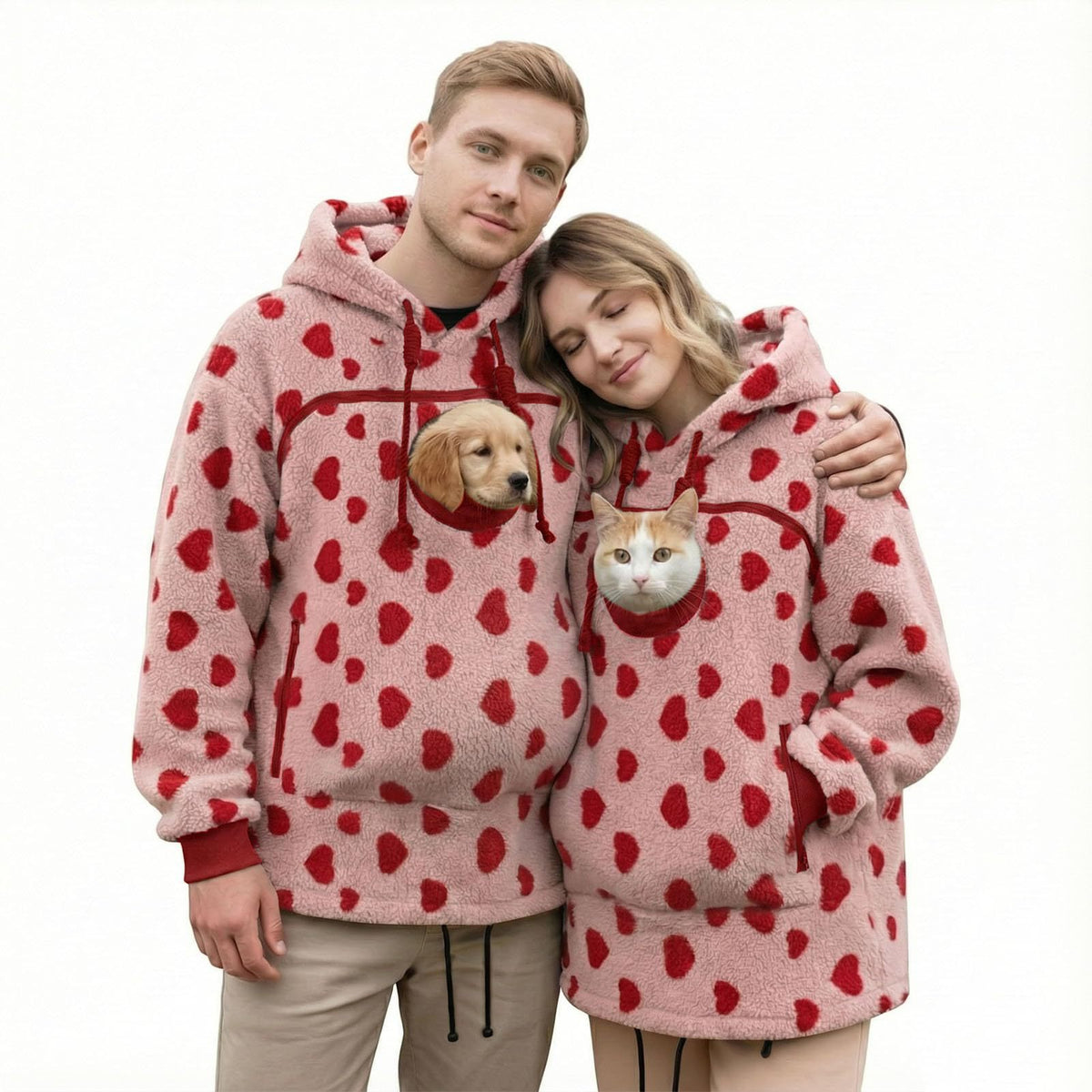 Couple in matching love Pawdie hoodies with a dog and a cat
