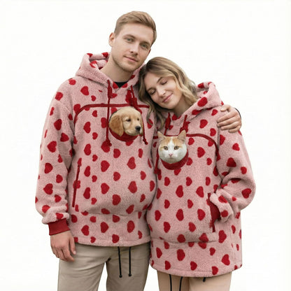 Couple in matching love Pawdie hoodies with a dog and a cat