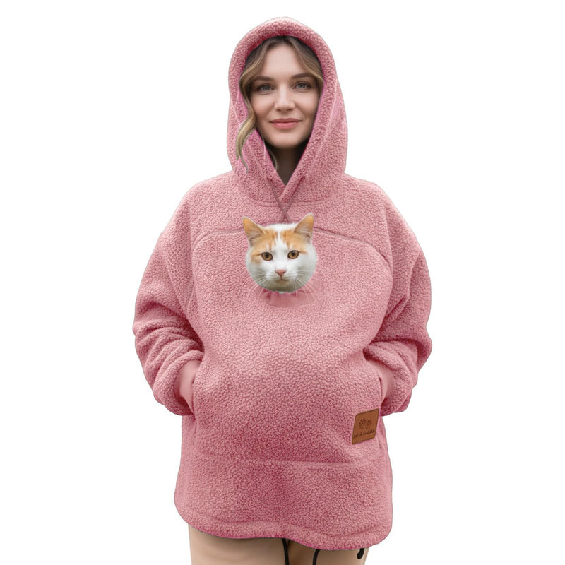 Cat in the pouch of a pink Pawdie hoodie